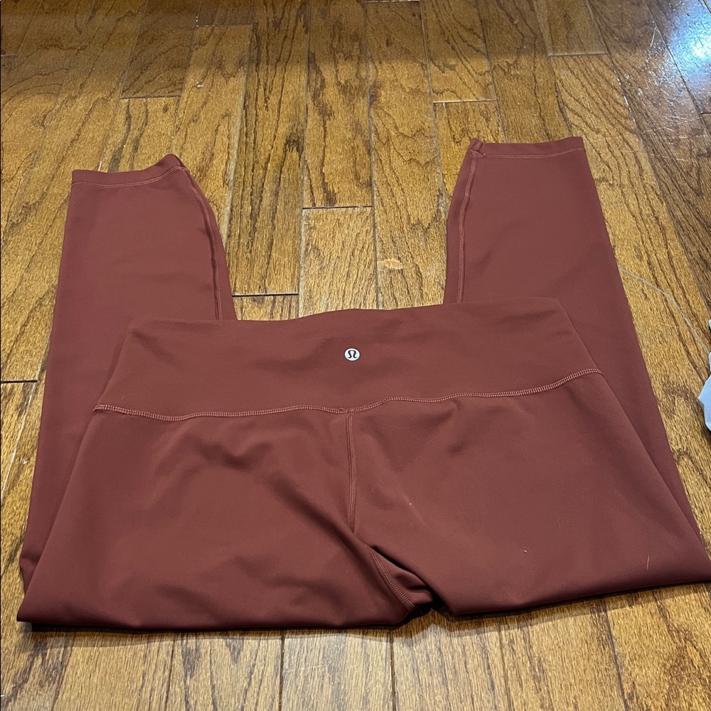 39. Lululemon Wunder Train HR 25” Brown-ish solid colored Leggings